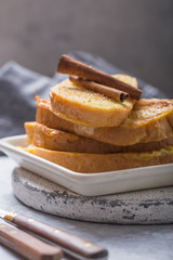 Traditional homemade Spanish torrijas on wooden background. Easter dessert.