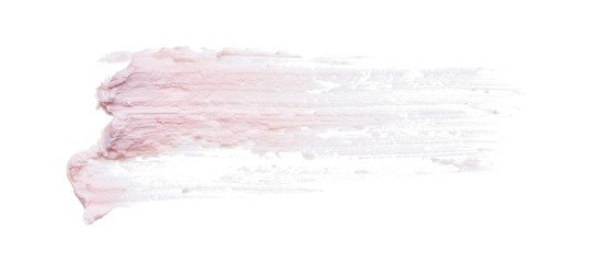 Gently pink brush strokes and texture of face cream or pink acrylic paint on a white background