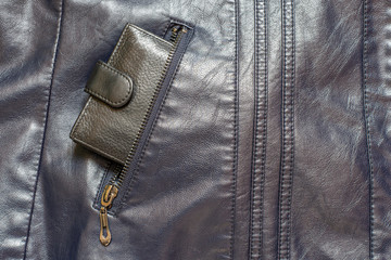 Wallet in a pocket of a leather jacket