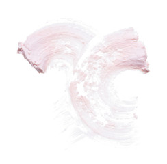 Gently pink brush strokes and texture of face cream or pink acrylic paint on a white background