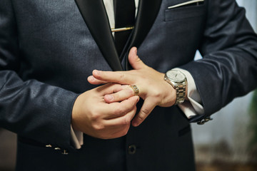 businessman puts a ring on finger