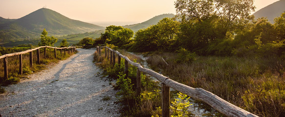 horizontal background path hill at sunset in the Euganean Hlls area Pianoro del Mottolone trail Padua Italy Veneto region