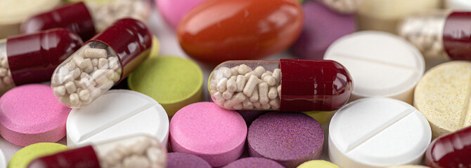The medicine concept. Multicolored medicines background. Different remedy, pills, capsule,...