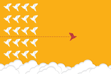 Think differently concept. Be different. Red bird changing direction. New idea, change, trend, courage, creative solution, innovation and unique way concept.	