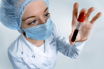 Doctor analyzes a test tube with a blood sample. New epidemic Coronavirus 2019-nCoV