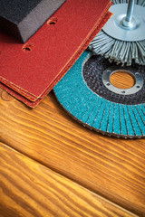 Set of abrasive tools and brown sandpaper on vintage wooden boards wizard is used for grinding items