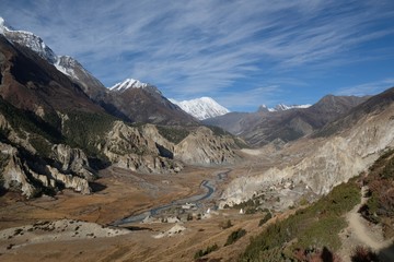 View of Annapurna range, Manang Valley and village Bhraka (Braga) with Gompa - Buddhist monastery in Himalaya, Nepal. During trekking around Annapurna - Annapurna Circuit trail