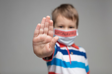 Young child wearing respiratory mask as a prevention against the Coronavirus Covid-19