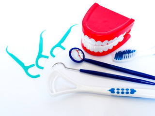 Teeth cleanliness tools, dental equipment with health care for gums and teeth isolated on white background.