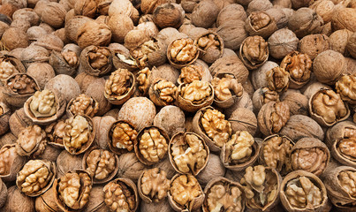 Cracked walnuts (remaining in shells) displayed for sale, Iran.