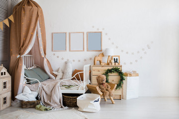 Stylish scandinavian  baby room with crib, dresser, wooden toys and lamp. zero waste. eco-friendly...