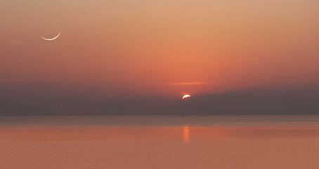 Sunrise and the waning moon is viewable.  (This picture is retouched by multi exposures)