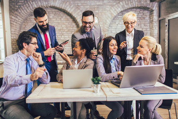 Group of business people working in office and discussing new ideas