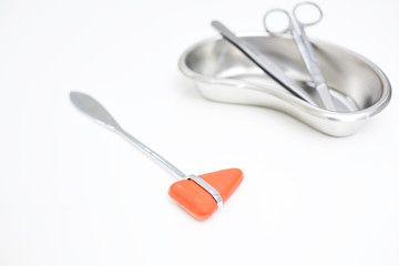 Medical instruments. a red reflex hammer. Neurology instruments, on white background. Tweezers ,...