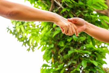 The handshake of the person conveying the meaning in a manner that helps each other to cooperate. Under the concept of teamwork.