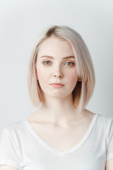 Indoor portrait of beautiful blonde young  woman