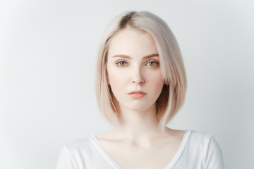 Indoor portrait of beautiful blonde young  woman