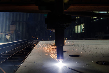 Plasma cutting of metal with a cnc. Plasma cutting machine cutting steel sheet. Laser cutter in production. Industrial metal cutting by plasma laser