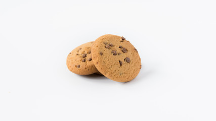 a pile of cookies with a splash of chocolate on a white background