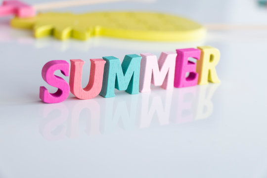 Summer word made of colorful wooden Letters isolated on a White Background