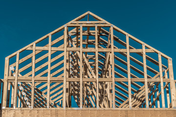 Wooden American house frame with blue sky background