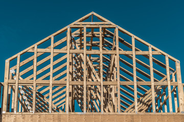 Wooden American house frame with blue sky background