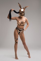 Anonymous sexy lady in metal bunny mask