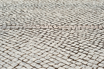 Paving the street in the city. Replacement of old paving tiles. Repairs. The pits on the roads, the old damaged cobblestone.