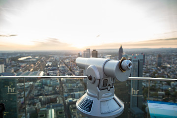 Telescope close-up at the observation deck of the city of Frankfurt, Germany. Copy space