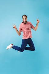 Excited happy man jumping isolated