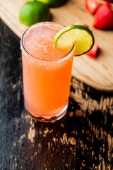 Frozen tropical cocktails. Traditional classic Hawaiian or tiki bar tropical drinks. Drinks w/  dark aged rum, blanco tequila, amaretto, garnished w/ limes pineapple cherries coconuts served frozen.
