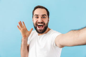 Fototapeta premium Man isolated take a selfie by camera.