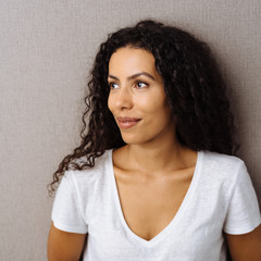 Young woman looking aside with a quiet smile