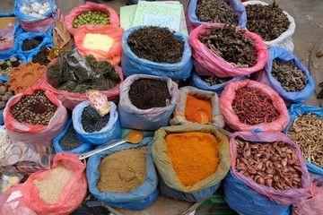 Colorful sacks with spices and dried vegetables at a market in Kathmandu, Nepal.
