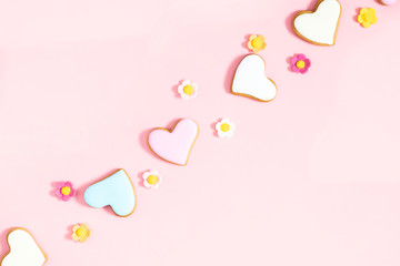 Ginger cookie in shape heart on pastel pink background. Sweet background. Valentine day food, concept, design. Flat lay, top view, copy space