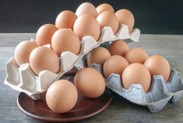 Eggs folded in paper trays on the kitchen table.