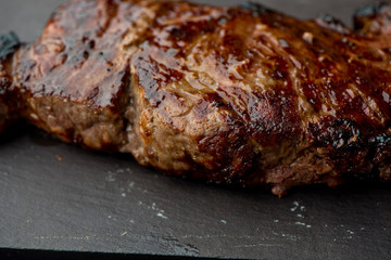 Steak. Grade A, grass fed angus beef. Traditional classic New York steakhouse menu favorite. T-bone steak, bone in, cooked to medium to rare and sliced. 
