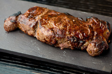 Steak. Grade A, grass fed angus beef. Traditional classic New York steakhouse menu favorite. T-bone steak, bone in, cooked to medium to rare and sliced. 
