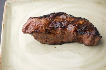Steak. Grade A, grass fed angus beef. Traditional classic New York steakhouse menu favorite. T-bone steak, bone in, cooked to medium to rare and sliced. 