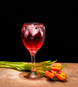  Bakal with tulip on wooden background