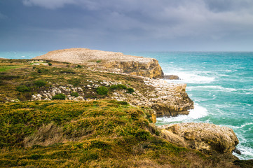 Suances cliffs next to the lighthouse, on stormy day with dramat