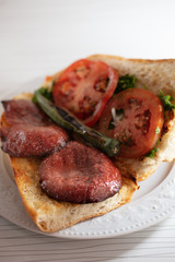fresh turkish sausage in bread with tomato