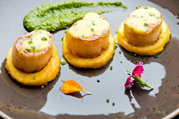 Scallops. Sea Scallops seared in brown butter sauce and garnished with a lemon sauce. 