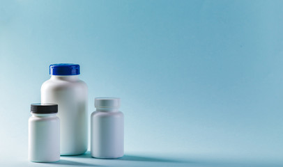 Bottle for Pills On Blue Background. Medicine Healthcare Pharmacy Concept. Coronavirus.