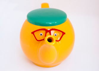 Funny teapot with eyes and glasses. Tea time creative card.