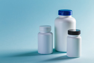 Bottle for Pills On Blue Background. Medicine Healthcare Pharmacy Concept. Coronavirus.