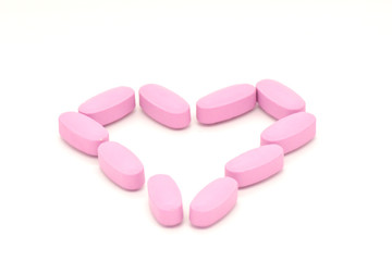 Obraz na płótnie Canvas Vitamin Complex Colorful pink pills. Doctors for advertising health. Medical picture.