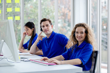 Team call center worker and operators with microphone and computer at work, Call center, support telemarketing.