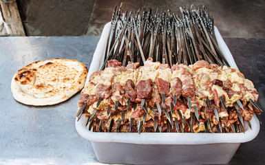 Grilled skewered lamb is one of the most favorite snacks and main food. Turpan Xinjiang, China.  