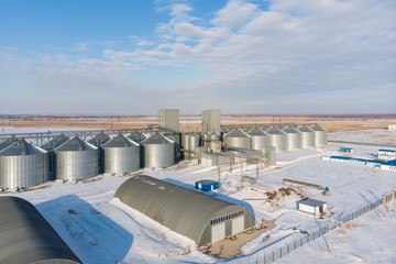 new built cereal elevator photographed from a drone at sunset in the winter